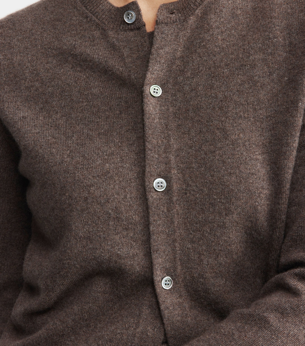 Close-up of a brown cardigan with button details